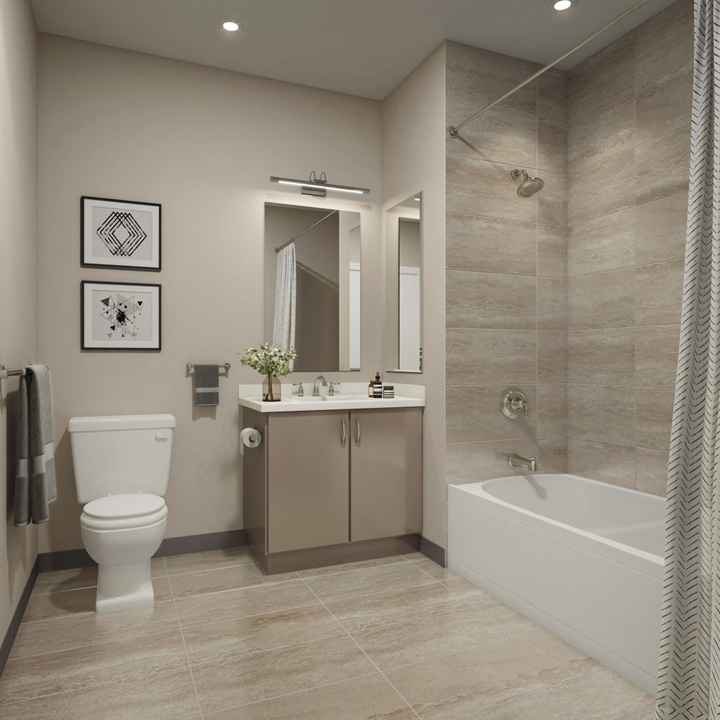 a bathroom with a toilet and a sink and a bath tub