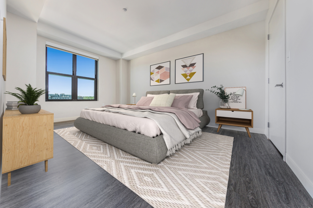 an open bedroom with a bed and a window