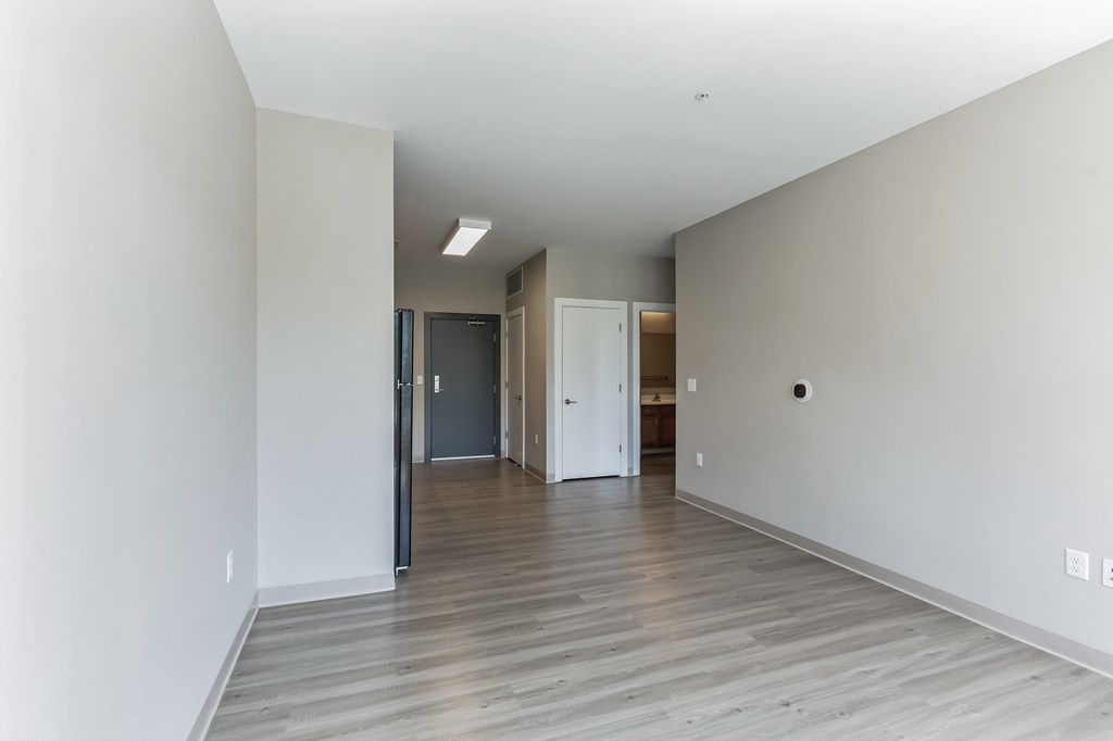 unfurnished living room with vinyl plank flooring