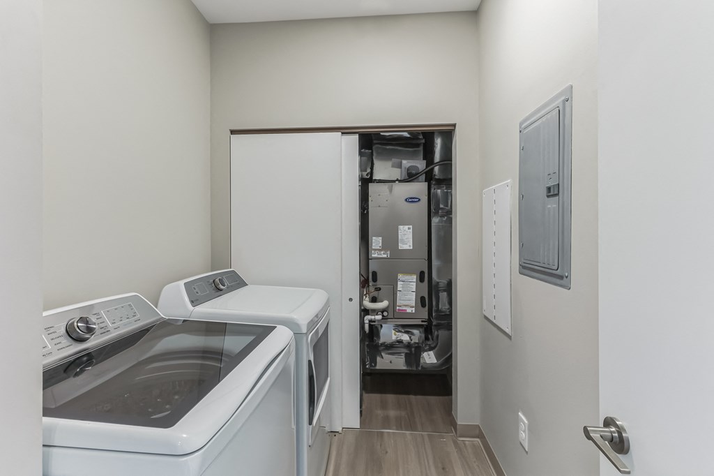 a kitchen with a sink and a machine in the wall