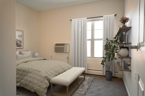 A bedroom with a large bed and a window with curtains.