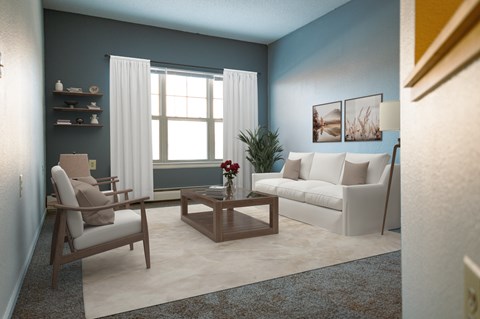 A living room with a white sofa, a wooden coffee table, and a chair.