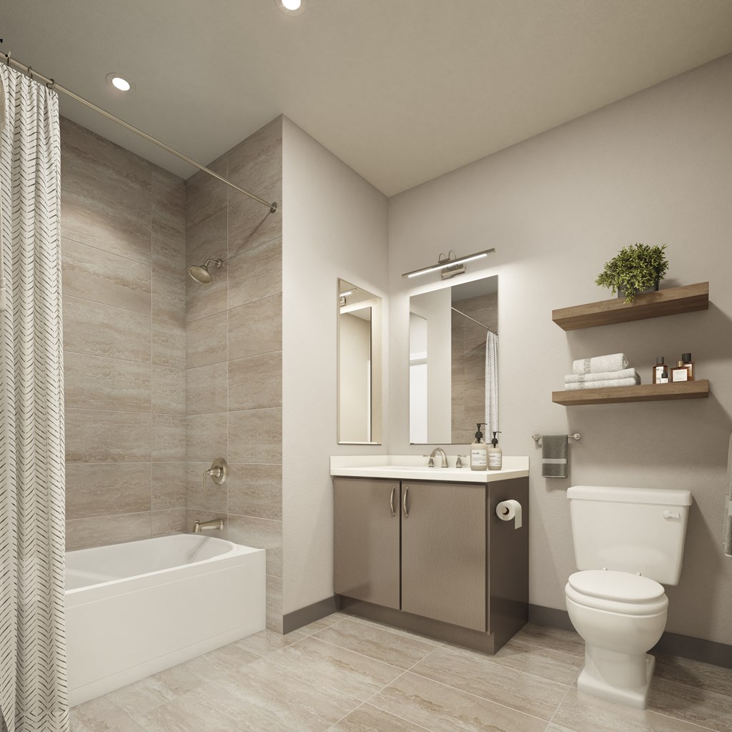 a bathroom with a toilet and a sink and a bath tub