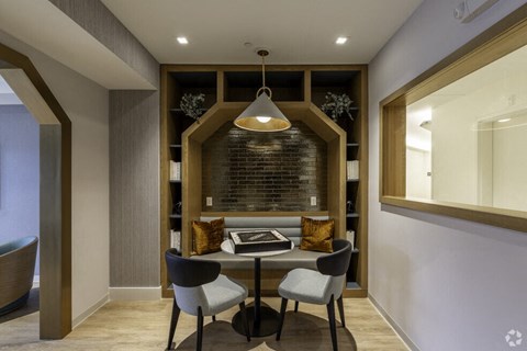 a dining room with a table and chairs
