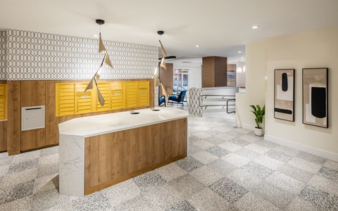 a large kitchen with yellow cabinets and a white counter top