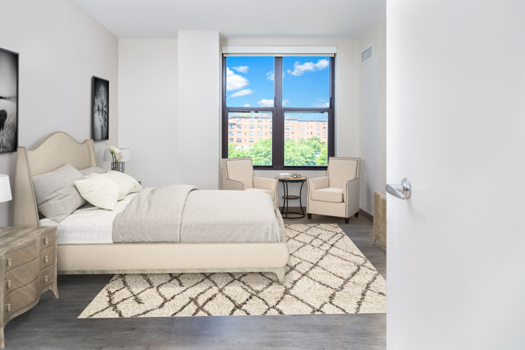 a bedroom with a bed and a window