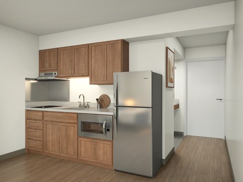 A kitchen with wooden cabinets and stainless steel appliances.