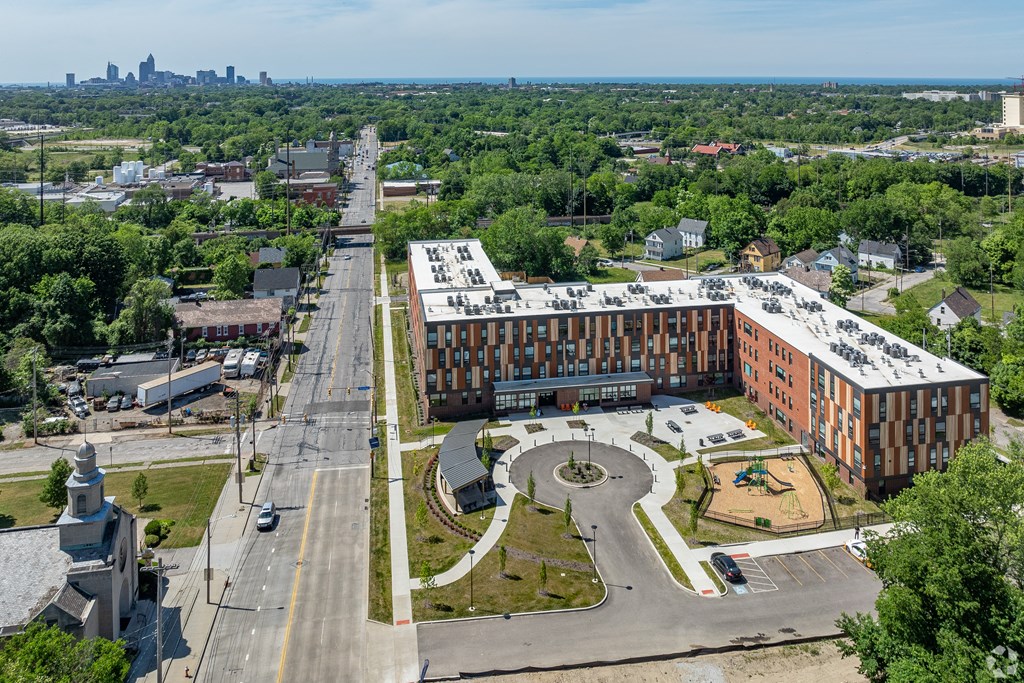an aerial view of a large building on a city street