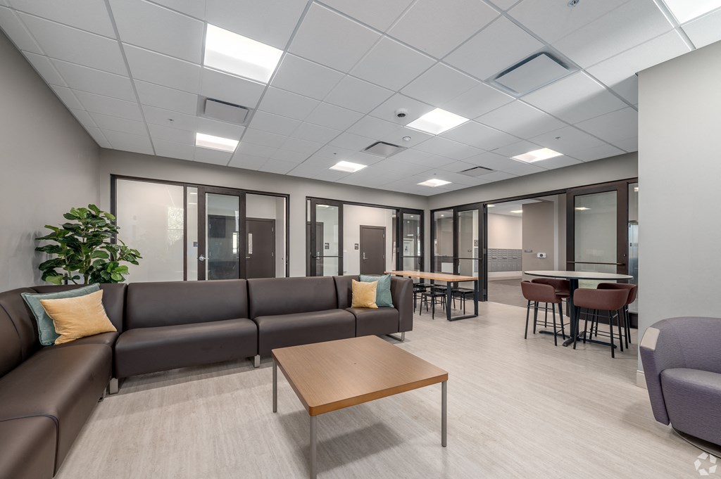 a large room with couches and tables and chairs