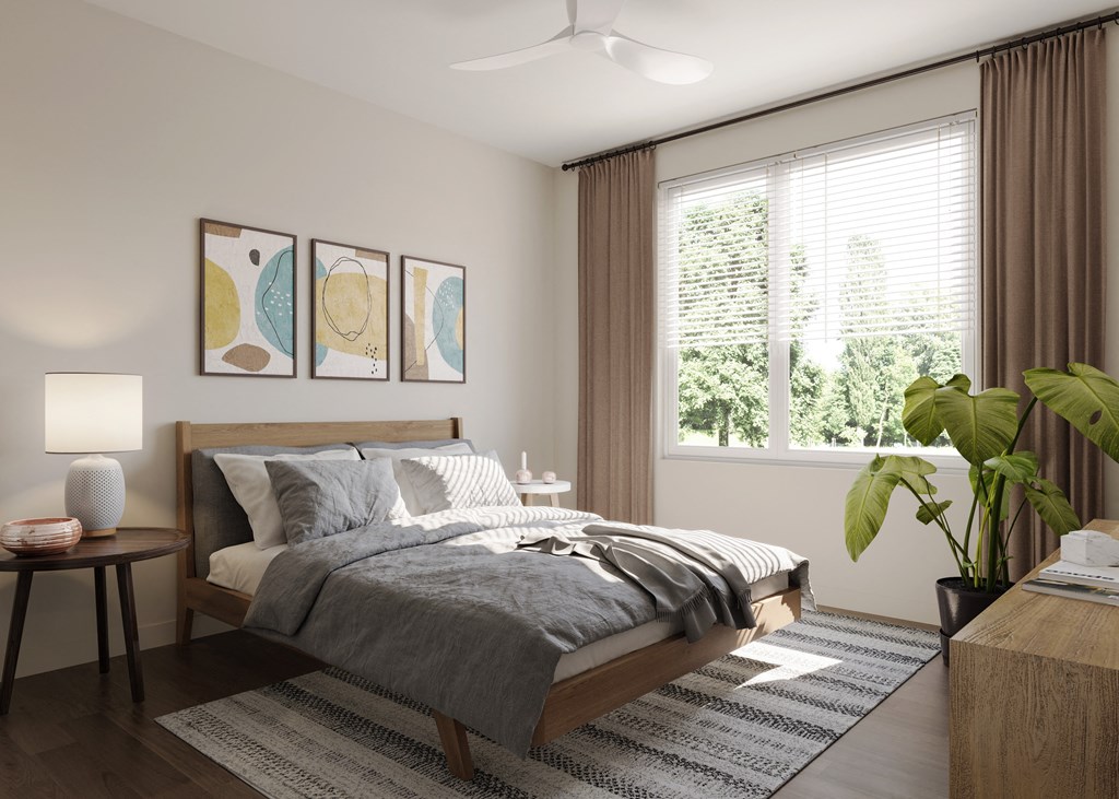 a bedroom with a bed and a large window