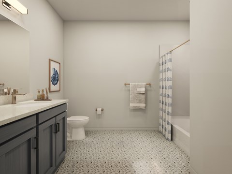 A bathroom with a toilet, sink, and shower.