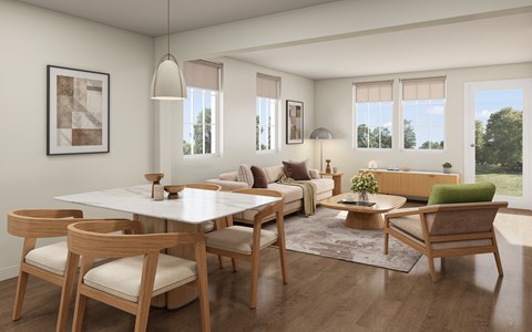 A modern dining room with a white table and wooden chairs.