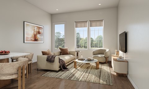 A living room with a couch, chairs, and a television.