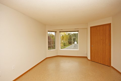 Empty room with a door and a window.