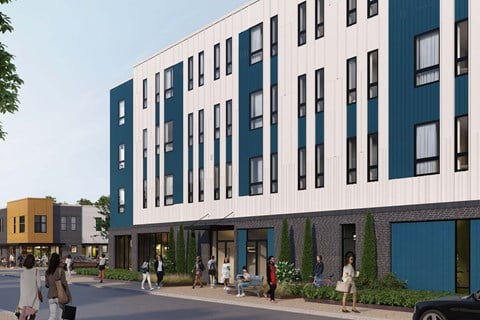 A modern building with blue and white panels and people walking in front.