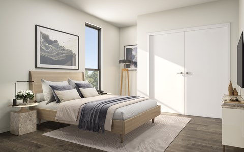 A bedroom with a large bed, a nightstand, and a television.