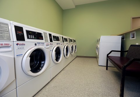 A row of washing machines in a laundromat.