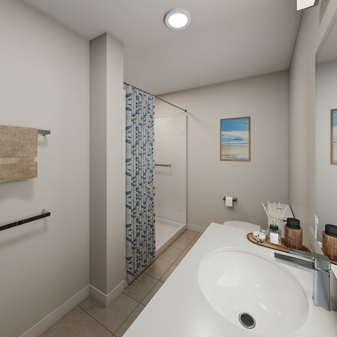 A bathroom with a white sink and a blue shower curtain.