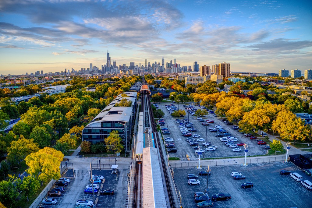 an aerial view of the skyline with a train on the tracks