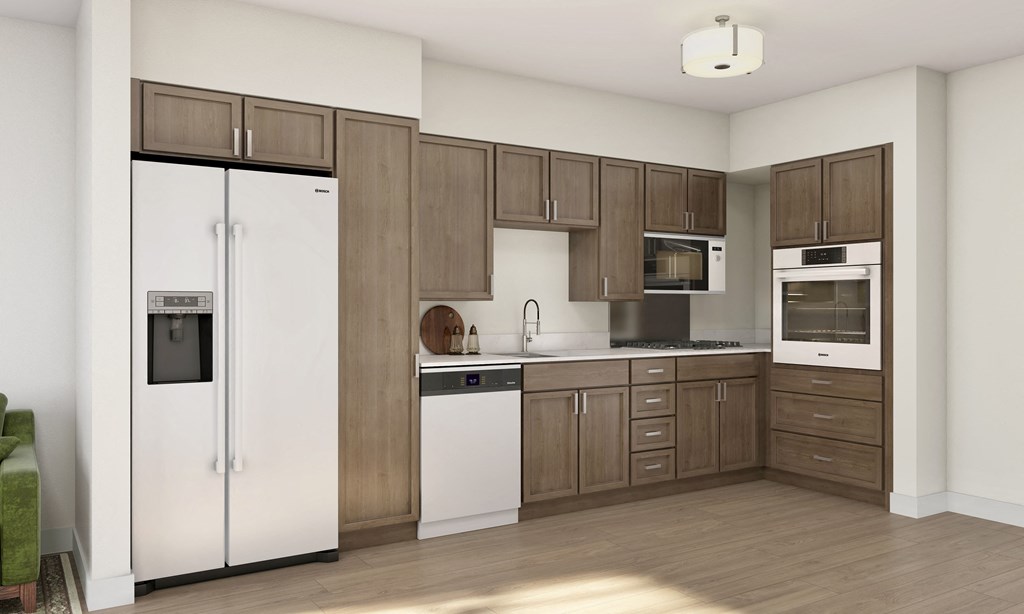 a kitchen with wooden cabinets and a white refrigerator