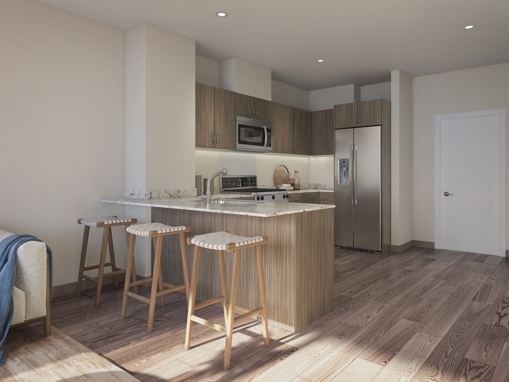 a kitchen with a marble counter top and three stools