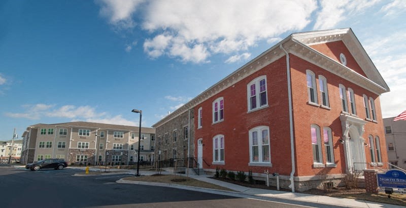 a red brick building on the corner of a street