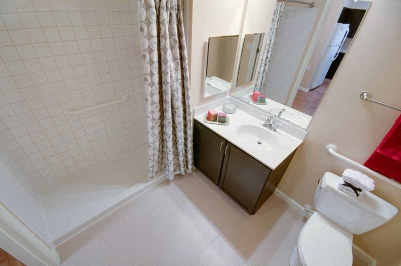 a bathroom with a sink toilet and a shower