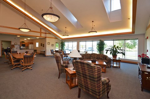 A large room with a skylight and a couch.