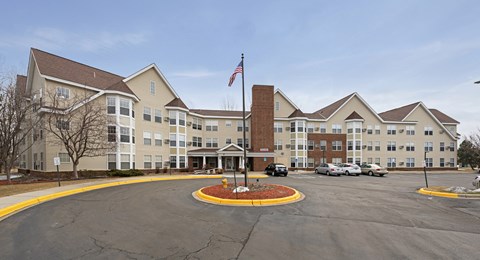 A large building with a flag on top of a pole.