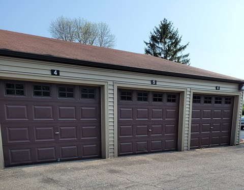 Two garage doors are numbered 4 and 6.