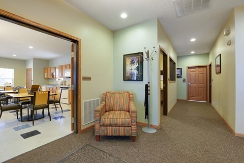 A living room with a couch and a chair.