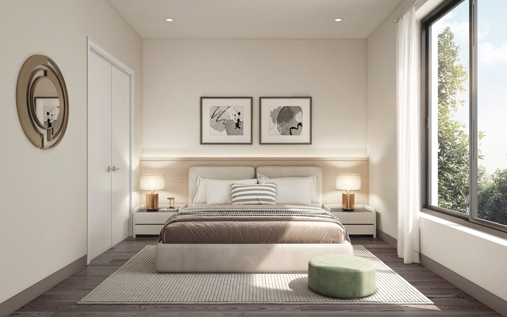 a bedroom with a bed and a window