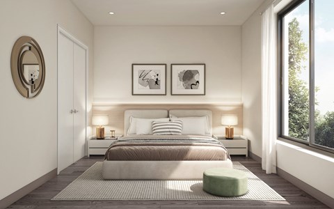 a bedroom with a bed and a window