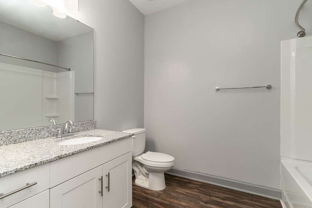 a bathroom with a toilet sink and bathtub at The Parker Myrtle Beach, South Carolina, 29588
