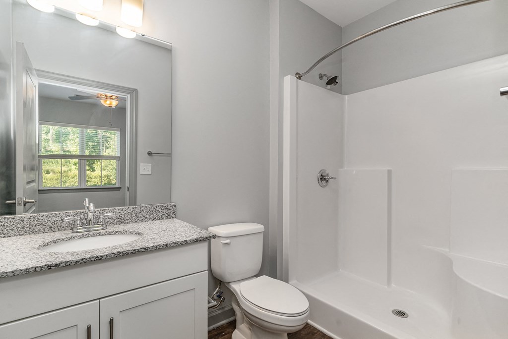 a bathroom with a bathtub toilet and sink