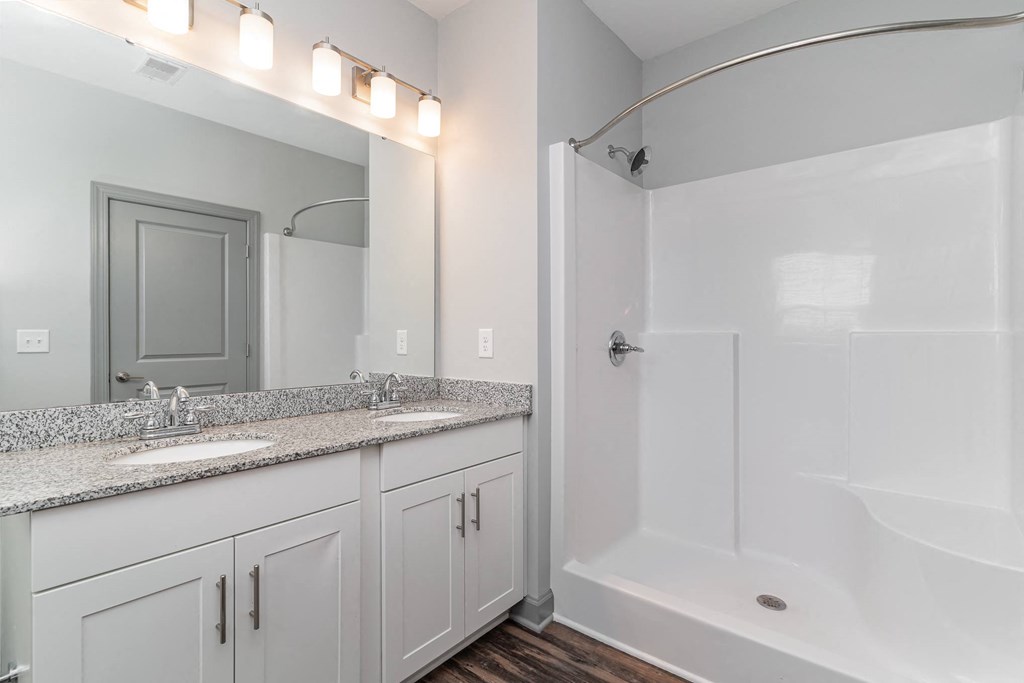 a bathroom with a bathtub and a sink at The Parker Myrtle Beach, Myrtle Beach, SC, 29588