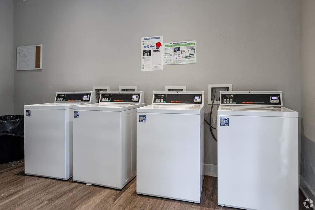 Four White Washing Machines at Avondale Place Apartments, Avondale Estates, GA