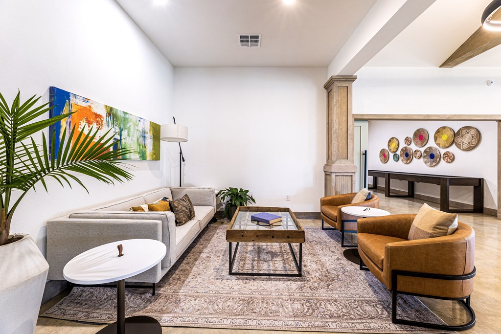 a living room with couches and chairs and a table at The Parker Austin, Texas