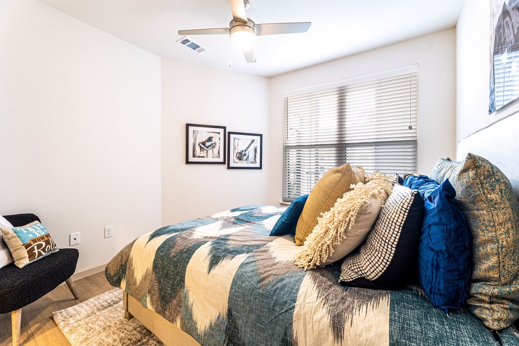 a bedroom with a bed and a ceiling fan at The Parker Austin, Pflugerville, 78660