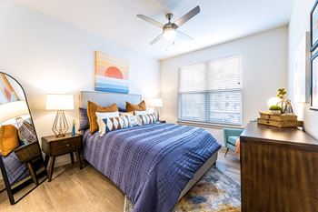 a bedroom with a bed and a ceiling fan at The Parker Austin, Pflugerville, Texas