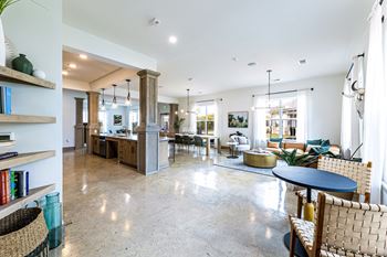 a large living room with a kitchen and a dining room at The Parker Austin, Pflugerville, TX