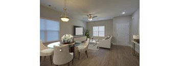 A dining room with a glass table and chairs.