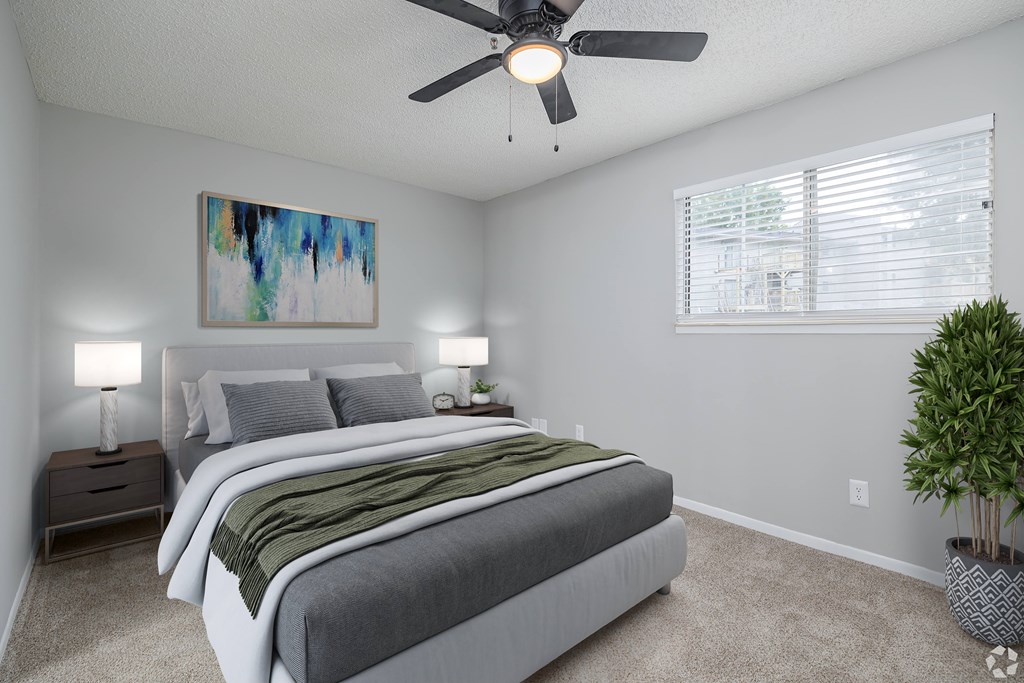 A Bedroom With Painting on the Wall at Avondale Place Apartments, Avondale Estates, GA, 30002