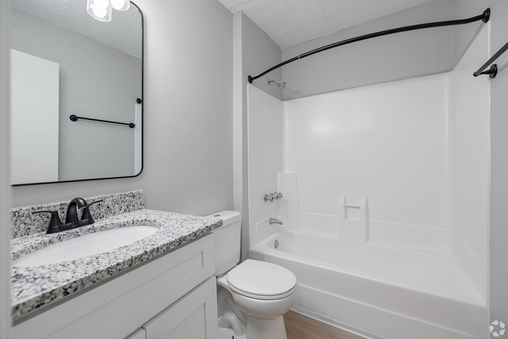 A Bathroom With Marble Countertop at Avondale Place Apartments, Avondale Estates, GA