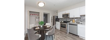 A Kitchen With Dining Table at Avondale Place Apartments, Georgia