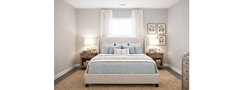 Bedroom with a large bed and two lamps at Club Villas Apartments, Kathleen, Georgia