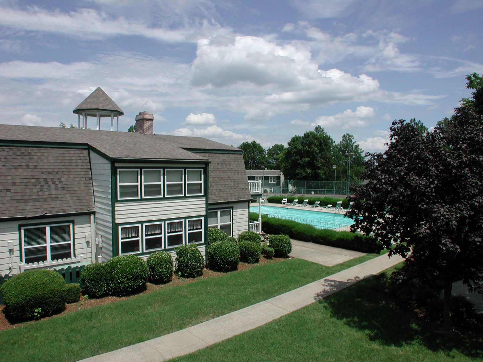 a house with a swimming pool in front of it