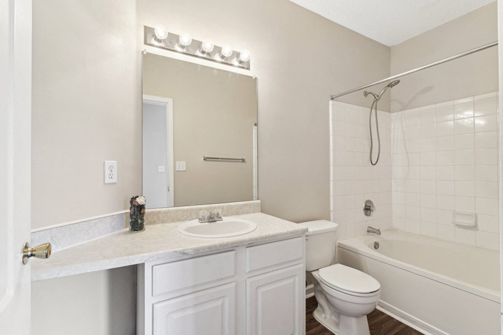 a bathroom with a sink toilet and a shower