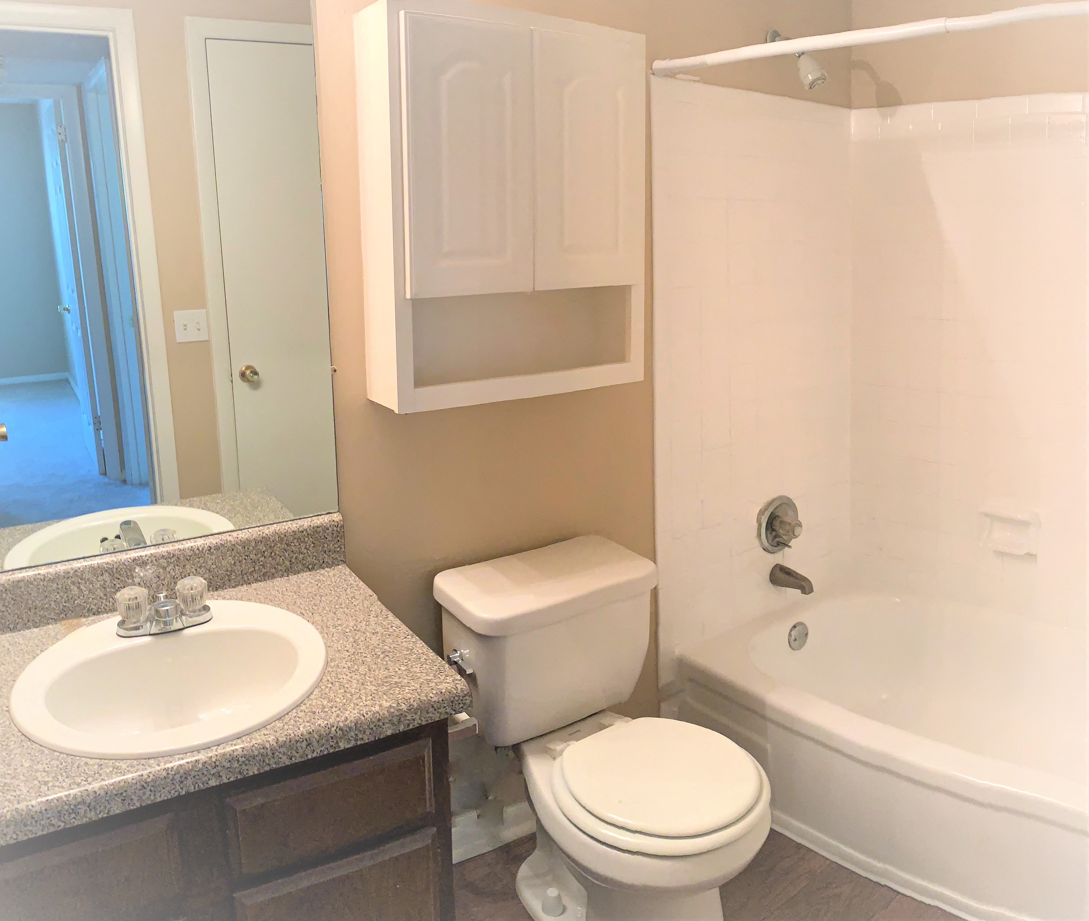 a bathroom with a sink toilet and bath tub