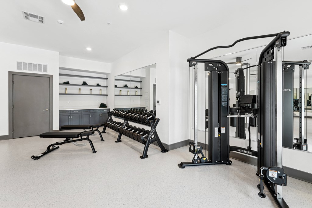 Gym has weights machines and a row of pilates benches at The Leo Myrtle Beach, South Carolina, 29579